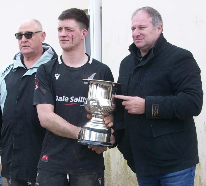 Robert Johns, Owain Evans and Phil Sutton at the trophy presentation (William John)